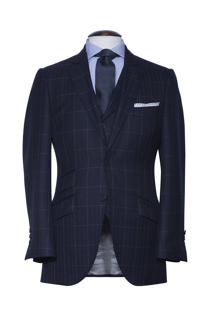 Le Kensington – Navy herringbone with a white overcheck, worsted wool – WICKET